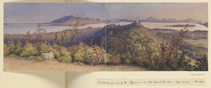 Wide watercolour seen from a hill with a golden pagoda: the town of Moulmein, a broad river mouth and distant mountains in the early morning