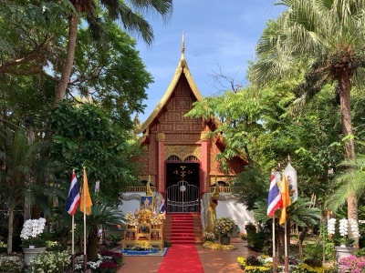 The ordination hall of Wat Phra Kaew, Chiang Rai, with a carved red and gold gable