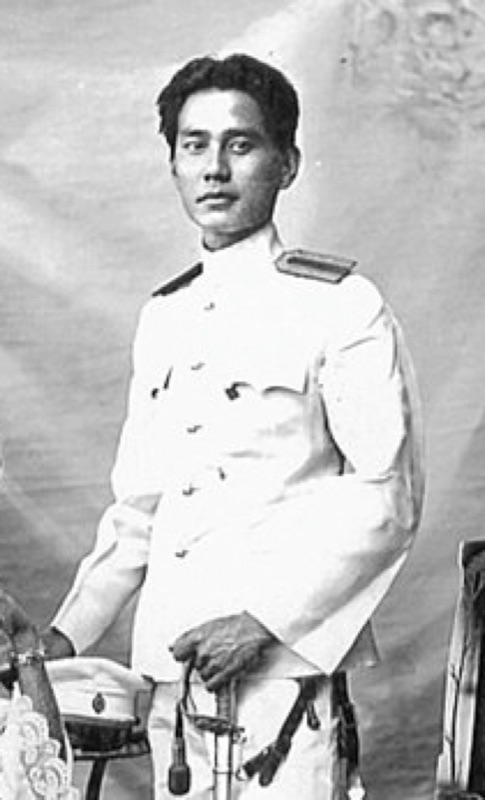 An old black-and-white photograph of Chao Noi Sukkasem na Chiang Mai in a white uniform, standing full length