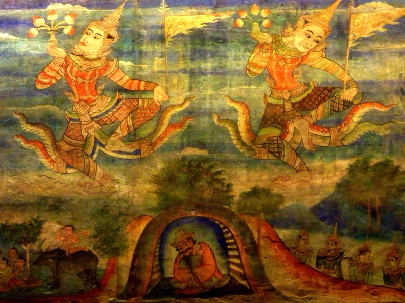 จิตรกรรมฝาผนังที่วัดพระสิงห์ เชียงใหม่ เป็นภาพเทวดาสองตนลอยในอากาศ มือถือช่อดอกไม้ ด้านล่างมีชายนั่งอยู่ในโพรงถ้ำ