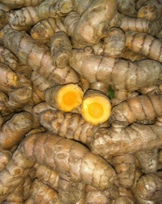 Cut turmeric showing yellow-orange flesh