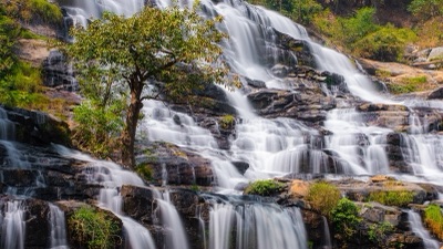 Mae Ya Waterfall cascading over many tiers of rock